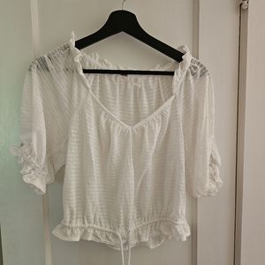 Free People white ruffled blouse | Size medium